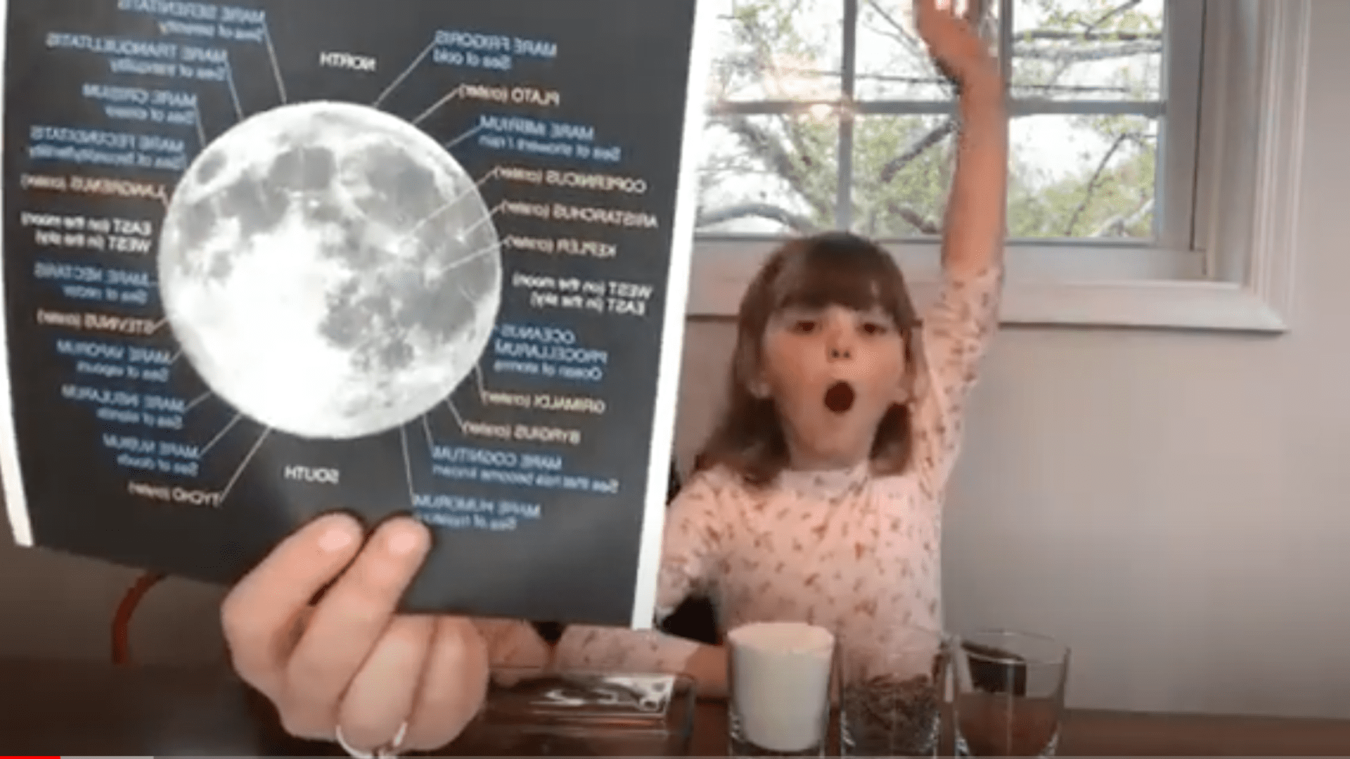 Moon Craters image held up for an excited child