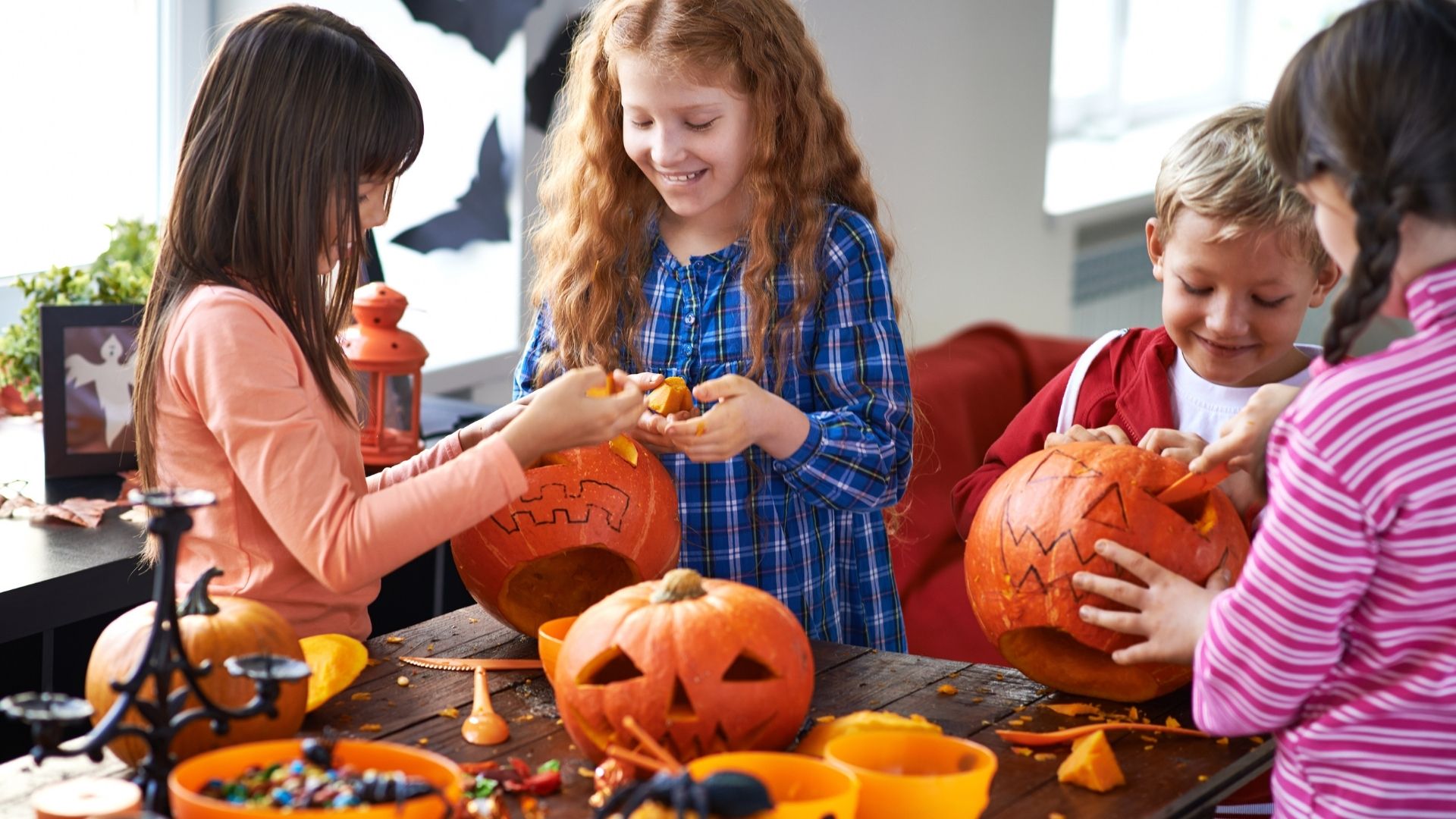 Halloween STEM activities children carving halloween jack-lanterns